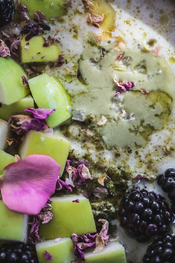 Cardamom rose porridge with matcha dust, sprouted pumpkin seed butter, green apple, blackberries