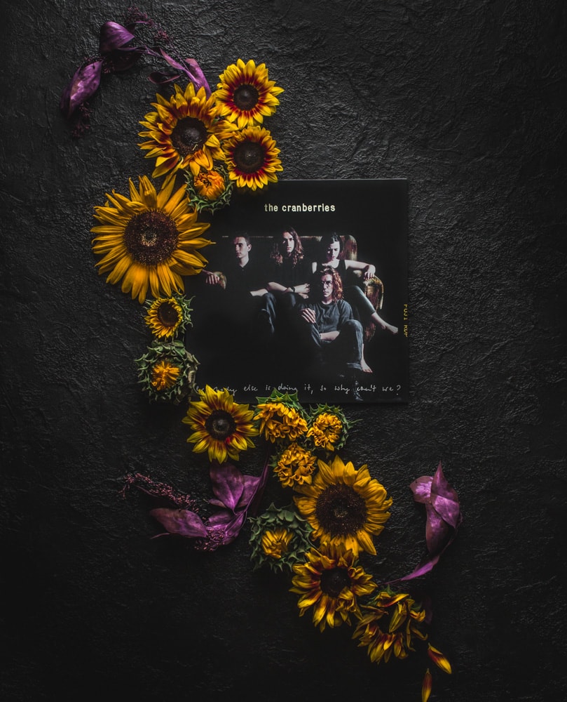 The Cranberries vinyl record surrounded by sunflowers