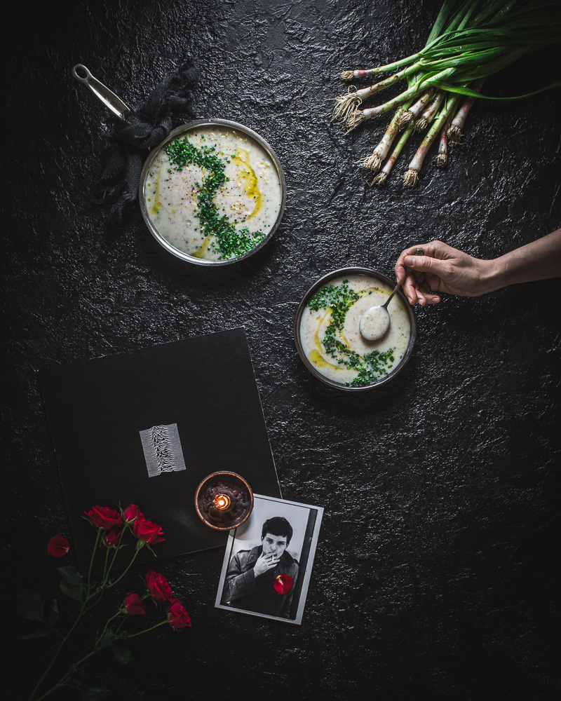 Ian Curtis memorial and Joy Division Unknown Pleasures record with red roses and potato leek soup